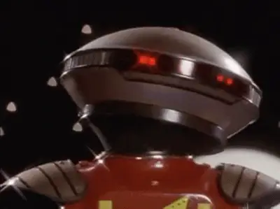GIF: a retro robot panicking, its red eyes flashing.